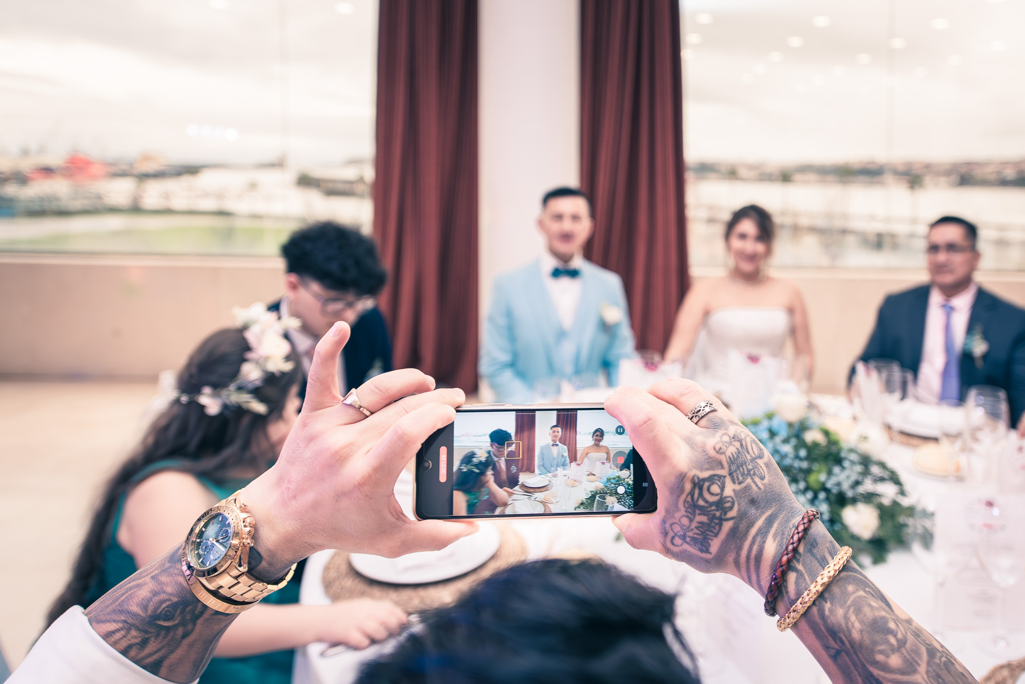 Snap being taken by Tattooed Arms at the Wedding Venue